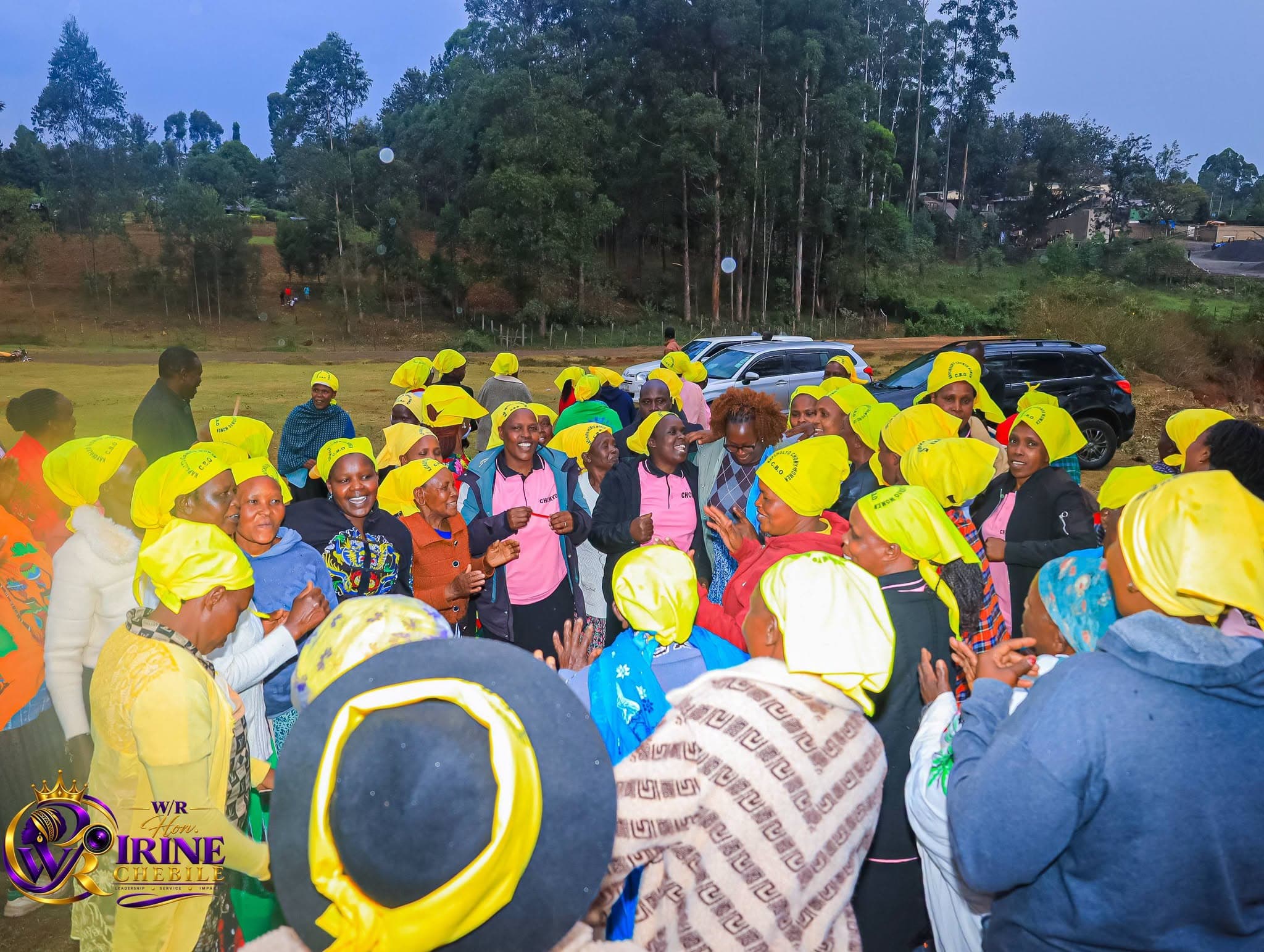 Women supporters in yellow headscarves gathered at an Irine Chebile event