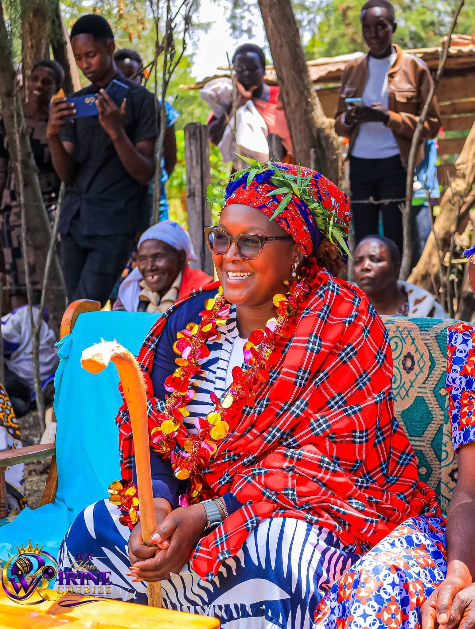 Irine Chebile, wearing a red shuka, honoured by elders at a community gathering
